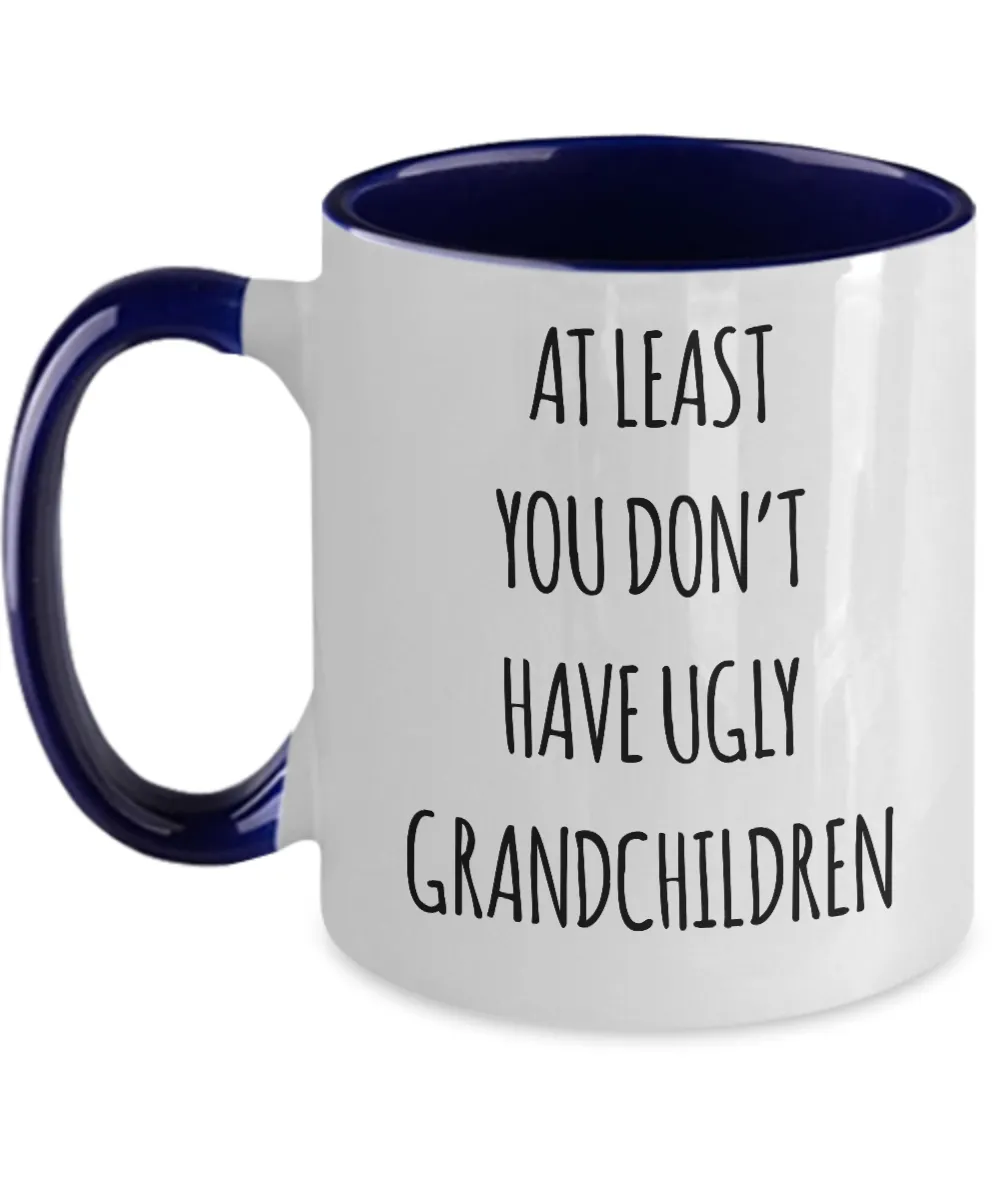 To Grandma At Least You Don't Have Ugly Grandchildren Two-Tone Mug Coffee Cup Funny Gift